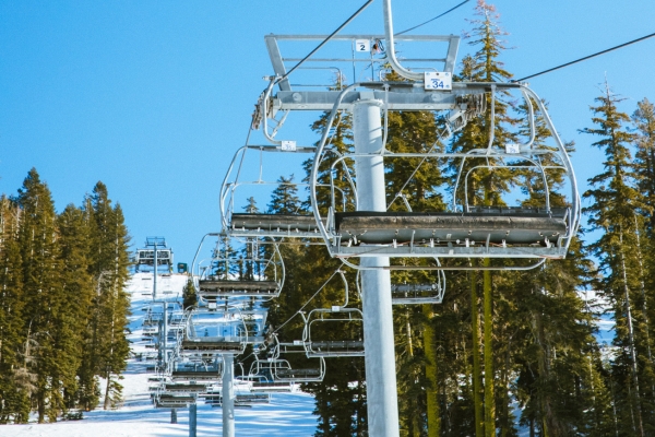 Chairlifts climbing the snowy slopes at Bear Valley Mountain Resort