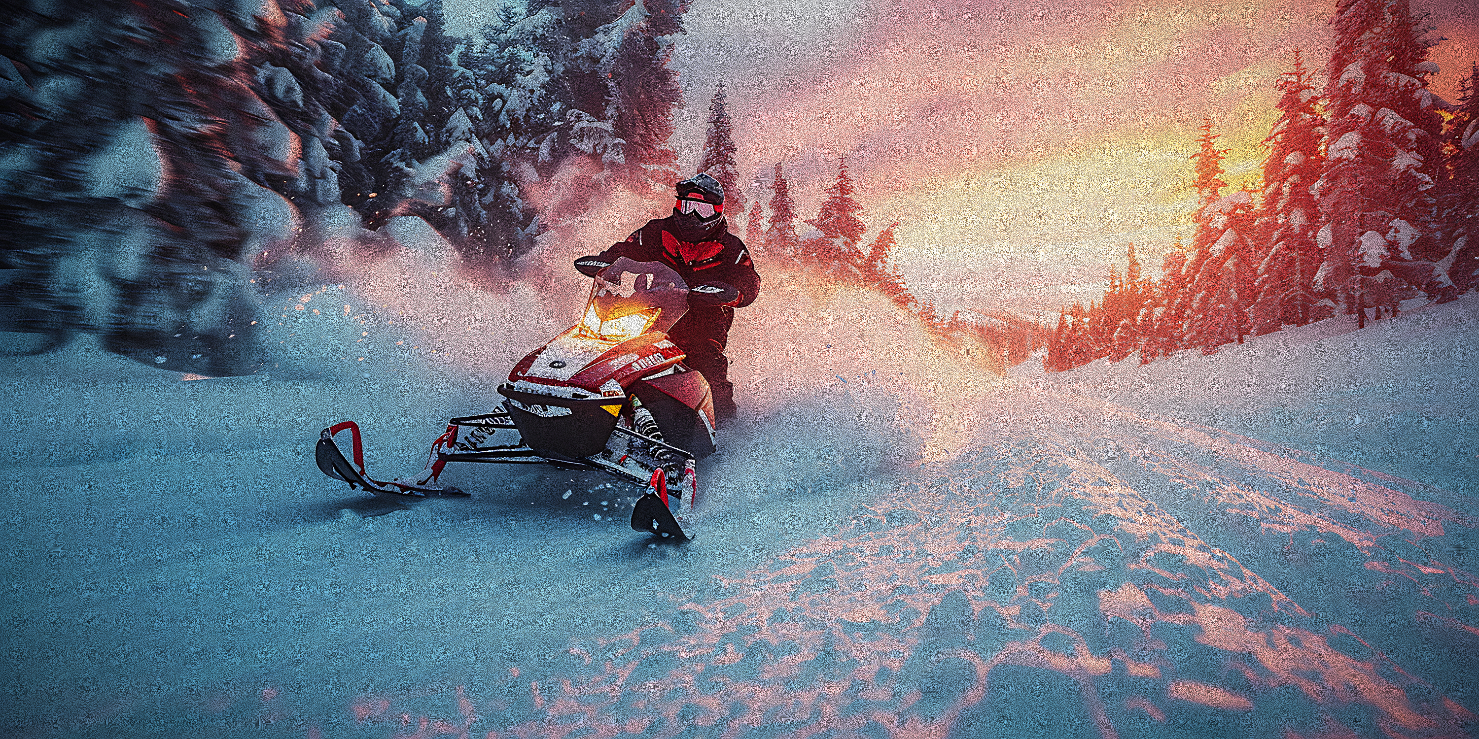A snowmobile rider crossing deep powder in the Sierra